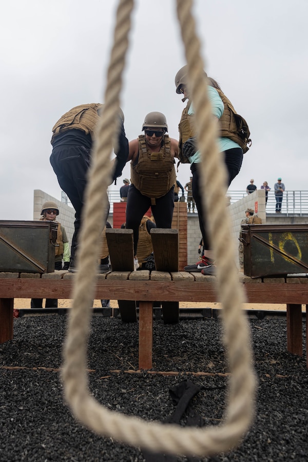 Educators participate in team building exercises during an Educators Workshop event at Marine Corps Base Camp Pendleton in Oceanside, Calif., June 5, 2024. The Educators Workshop program provides selected educators and influential community members with an experiential opportunity to see how the Marine Corps transforms young men and women into Marines. The workshop also provides attendees with current information regarding Marine Corps training practices, military job skills, service opportunities, military lifestyle, and educational benefits available to Marines. (U.S. Marine Corps photo by Sgt. Ryan Harvey)