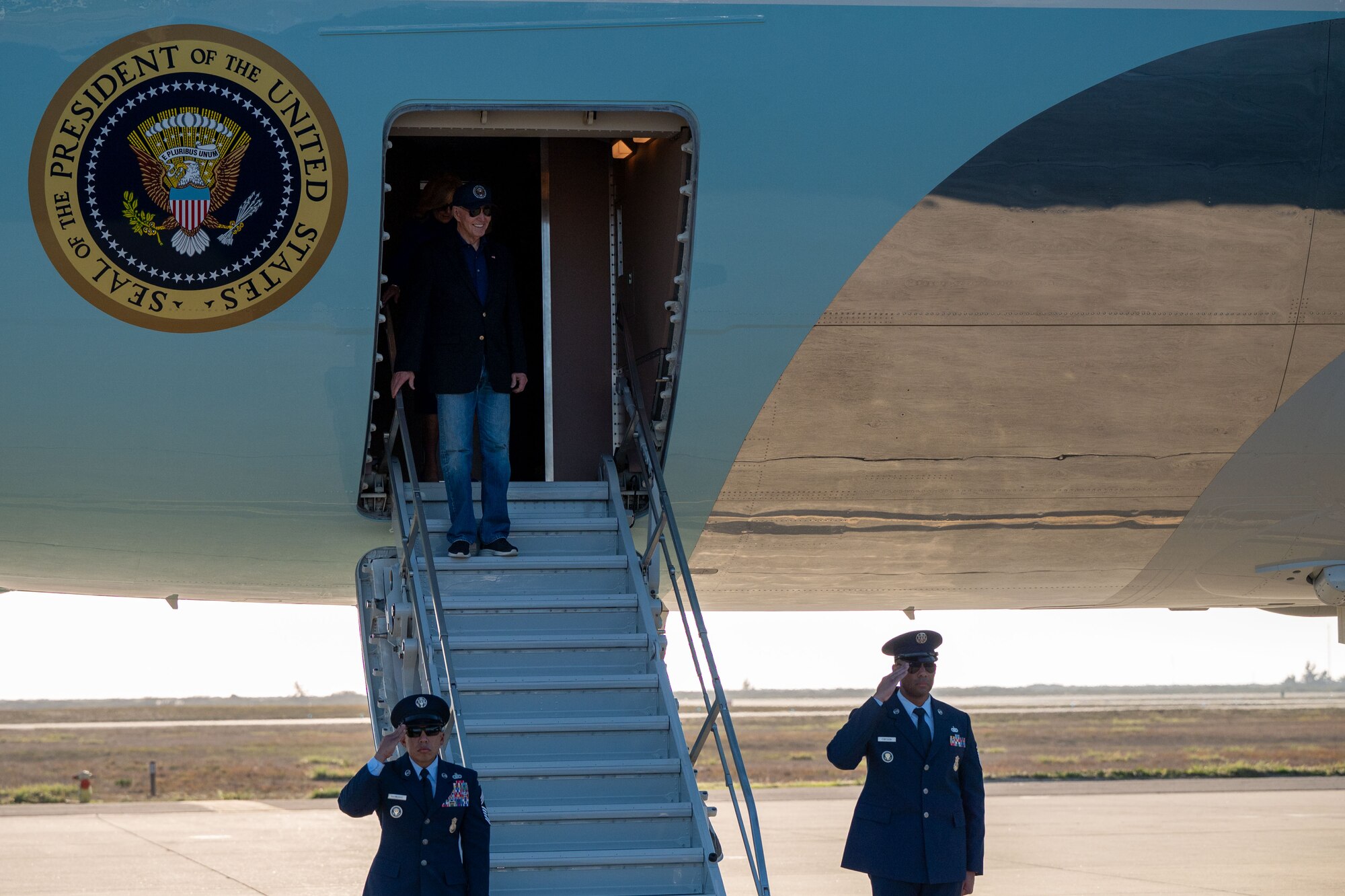 Joe Biden walks down the stairs of Air Force One.