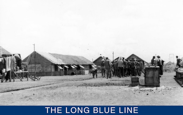 A rare photograph of Allied POWs marching in formation at Cabanatuan Prison. Crotty was remembered by fellow prisoners for his sense optimism despite his dire surroundings in the prison camp. (Courtesy of the MacArthur Memorial Library, Norfolk, Virginia)