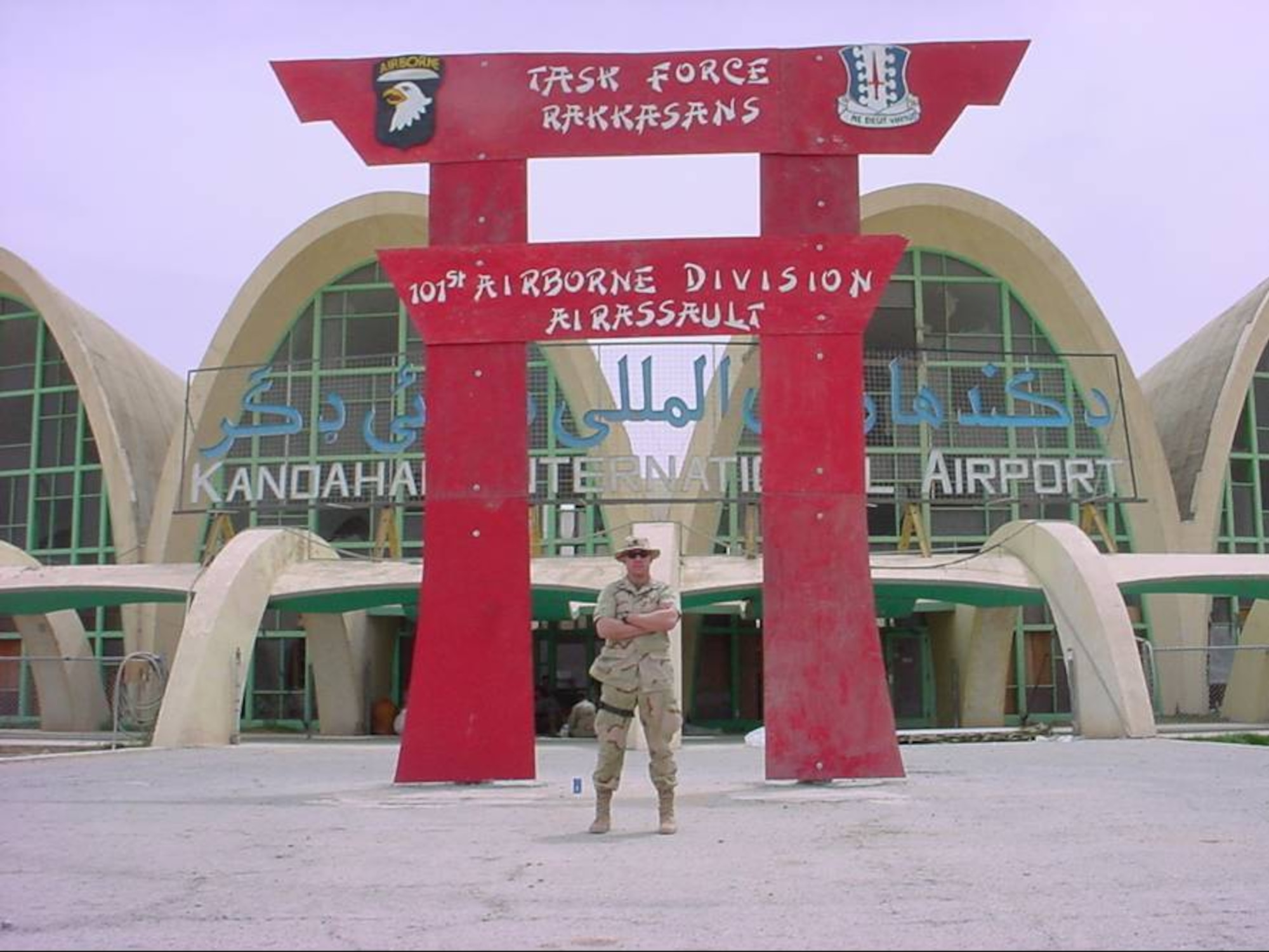 Man stand in front of sign