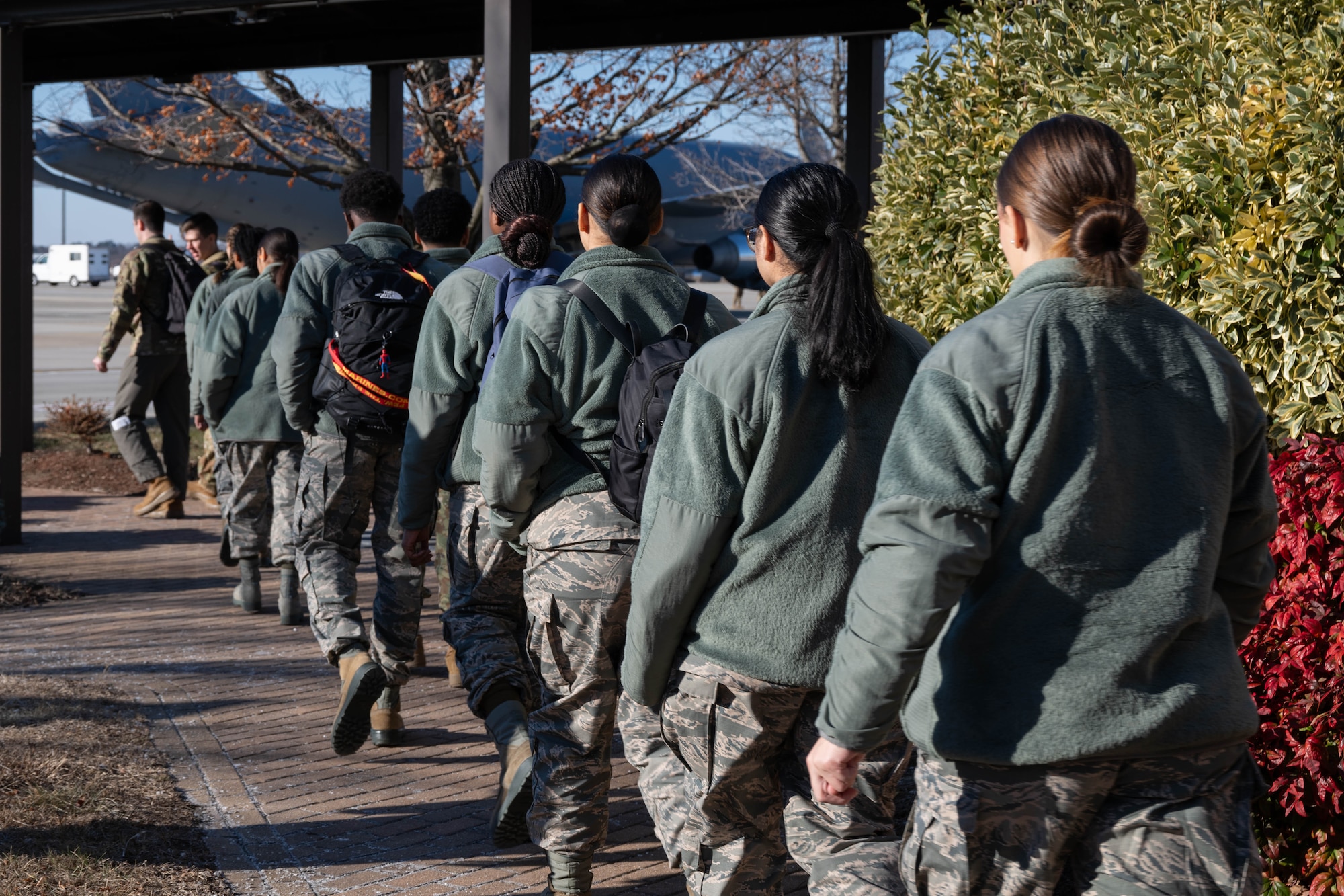 Students from Mount Olive High School Junior Reserve Officers' Training Corps walk onto the flight line at Joint Base McGuire-Dix-Lakehurst, N.J., Jan. 14, 2025. JROTC students from Mount Olive High School flew on the 2nd Aerial Refueling Squadron’s KC-46A Pegasus aircraft as a part of the Aviation Inspiration Mentorship program to enhance their understanding of the Air Force’s aviation mission. (U.S. Air Force photo by Senior Airman Aidan Thompson)