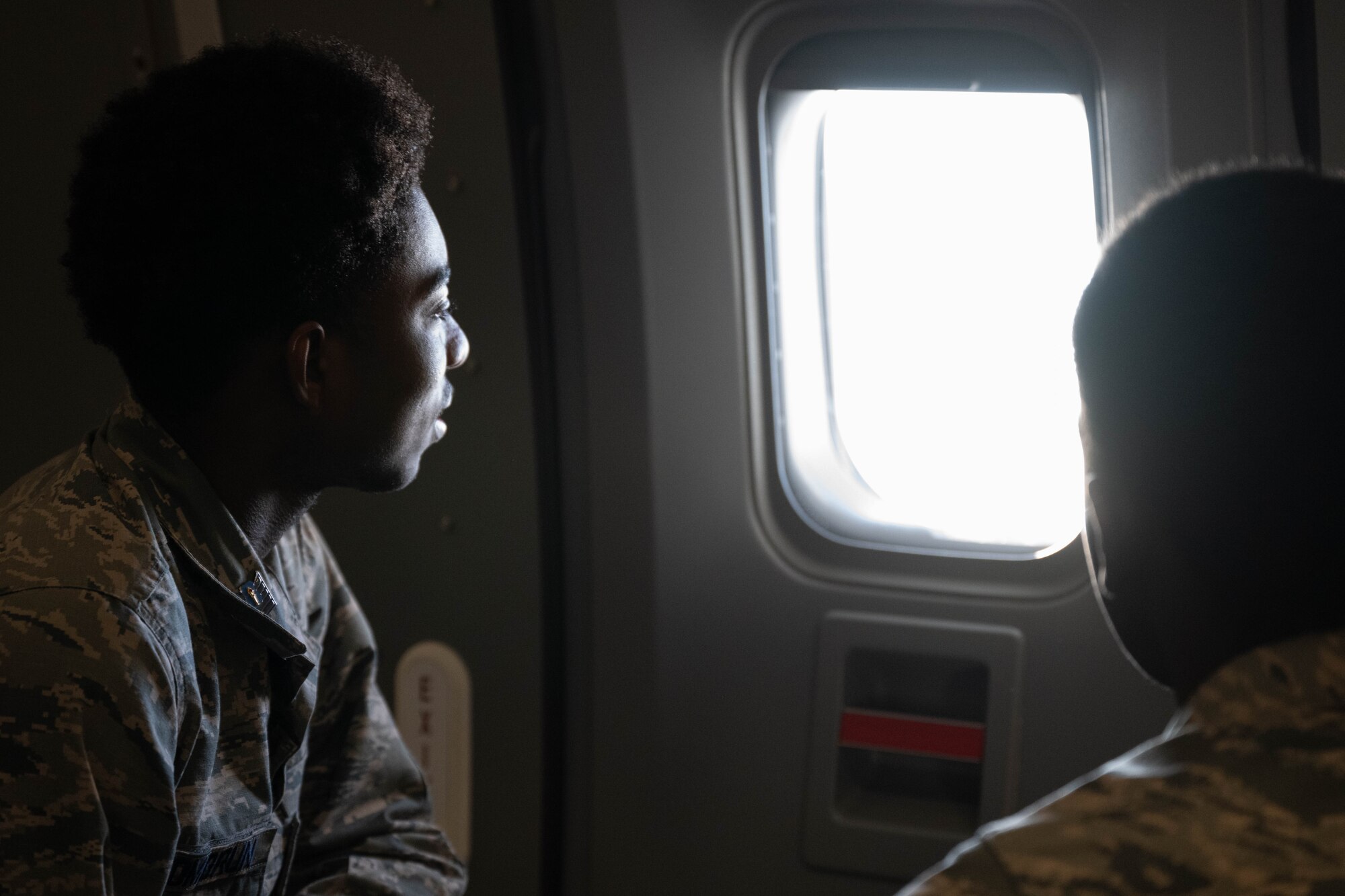 Students from Mount Olive High School Junior Reserve Officers' Training Corps look out of the window of a KC-46A Pegasus aircraft while flying over Joint Base McGuire-Dix-Lakehurst, N.J., Jan. 14, 2025. JROTC Students from Mount Olive High School flew on the 2nd Aerial Refueling Squadron’s KC-46A as part of the Aviation Inspiration Mentorship program to enhance their understanding of the Air Force’s aviation mission. (U.S. Air Force photo by Senior Airman Aidan Thompson)