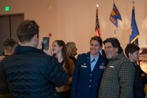 U.S. Air Force Lt. Col. Ketron takes a photo with guests at the activation and assumption of command ceremony where she assumed command of the 932nd Battle Management Control Group on Beale Air Force Base, California, Jan. 23, 2025.