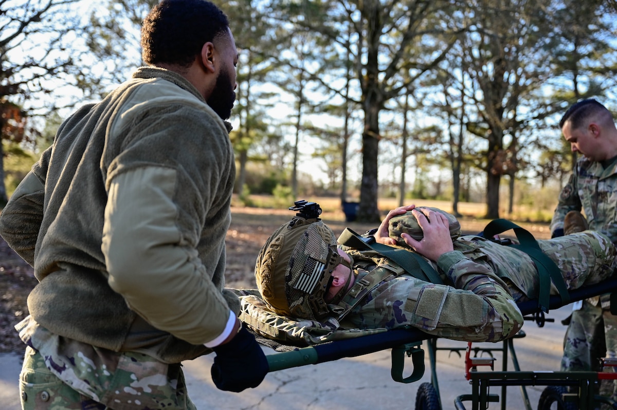 Airmen carry a patient