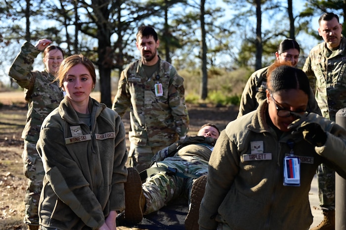 Medical personnel carry a patient
