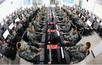 Chinese soldiers browse news on desktop computers at People’s Liberation Army garrison in Chongqing, China.