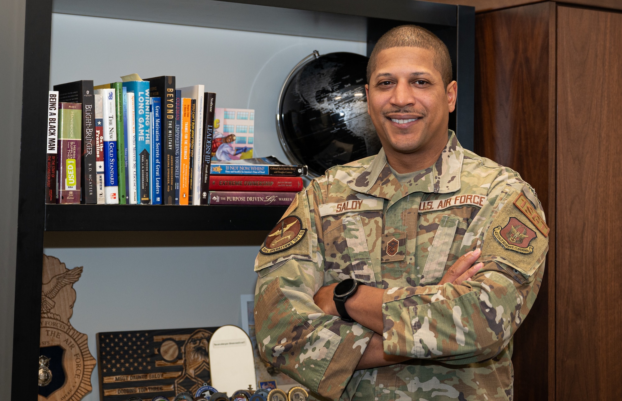 U.S. Air Force Master Sgt. Daunte Saloy, 908th Operations Support Squadron first sergeant, Foundations 300, 500 and 700 Course facilitator and mentor, poses for a photo in his office at Maxwell Air Force Base, Alabama, Jan. 1, 2025.