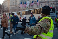 U.S. Army Sgt. Anthony Jauregui, 244th Aviation Regiment, 90th Troop Command, Oklahoma Army National Guard, provides security during the presidential motorcade while assigned with Joint Task Force-District of Columbia (JTF-DC) in support of the 60th Presidential Inauguration in Washington, D.C., Jan. 20, 2025, as a member of Joint Task Force-District of Columbia (JTF-DC) in support of the 60th Presidential Inauguration in Washington D.C., Jan. 19, 2025. Approximately 8,000 National Guard service members from approximately 40 states and territories comprise JTF-DC to support the 60th Presidential Inauguration, continuing a legacy that began in 1789 when their predecessors escorted George Washington to the first inauguration. At the request of civil authorities, these National Guard service members provide critical support such as crowd management, traffic control points, CBRN response, civil disturbance response and sustainment operations. Their expertise and seamless collaboration with interagency partners help ensure a safe and peaceful transition of power during this historic event.