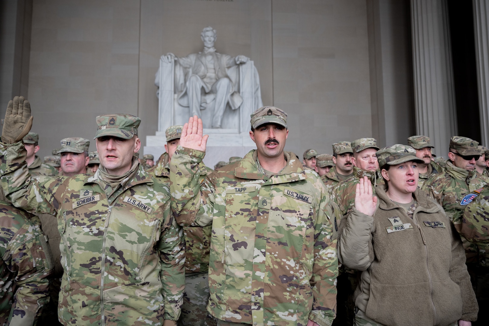 Idaho Army National Guard Soldiers assigned to Joint Task Force District of Columbia (JTF-DC) recite the oath of enlistment in front of the Lincoln Memorial  in Washington D.C., Jan. 21, 2025. Approximately 8,000 National Guard service members from approximately 40 states and territories comprise JTF-DC to support the 60th Presidential Inauguration, continuing a legacy that began in 1789 when their predecessors escorted George Washington to the first inauguration. At the request of civil authorities, these National Guard service members provide critical support such as crowd management, traffic control points, CBRN response, civil disturbance response and sustainment operations. Their expertise and seamless collaboration with interagency partners help ensure a safe and peaceful transition of power during this historic event.