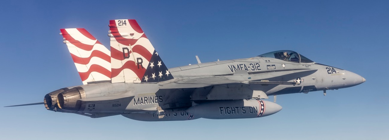 A U.S. Marine Corps F/A-18C Hornet aircraft with Marine Fighter Attack Squadron (VMFA) 312, Marine Aircraft Group 12, 1st Marine Aircraft Wing flies over the Pacific Ocean while armed with an AGM-88 High-speed Anti-Radiation missile during the squadron's support of the Aviation Training Relocation Program, Jan. 24, 2025.
