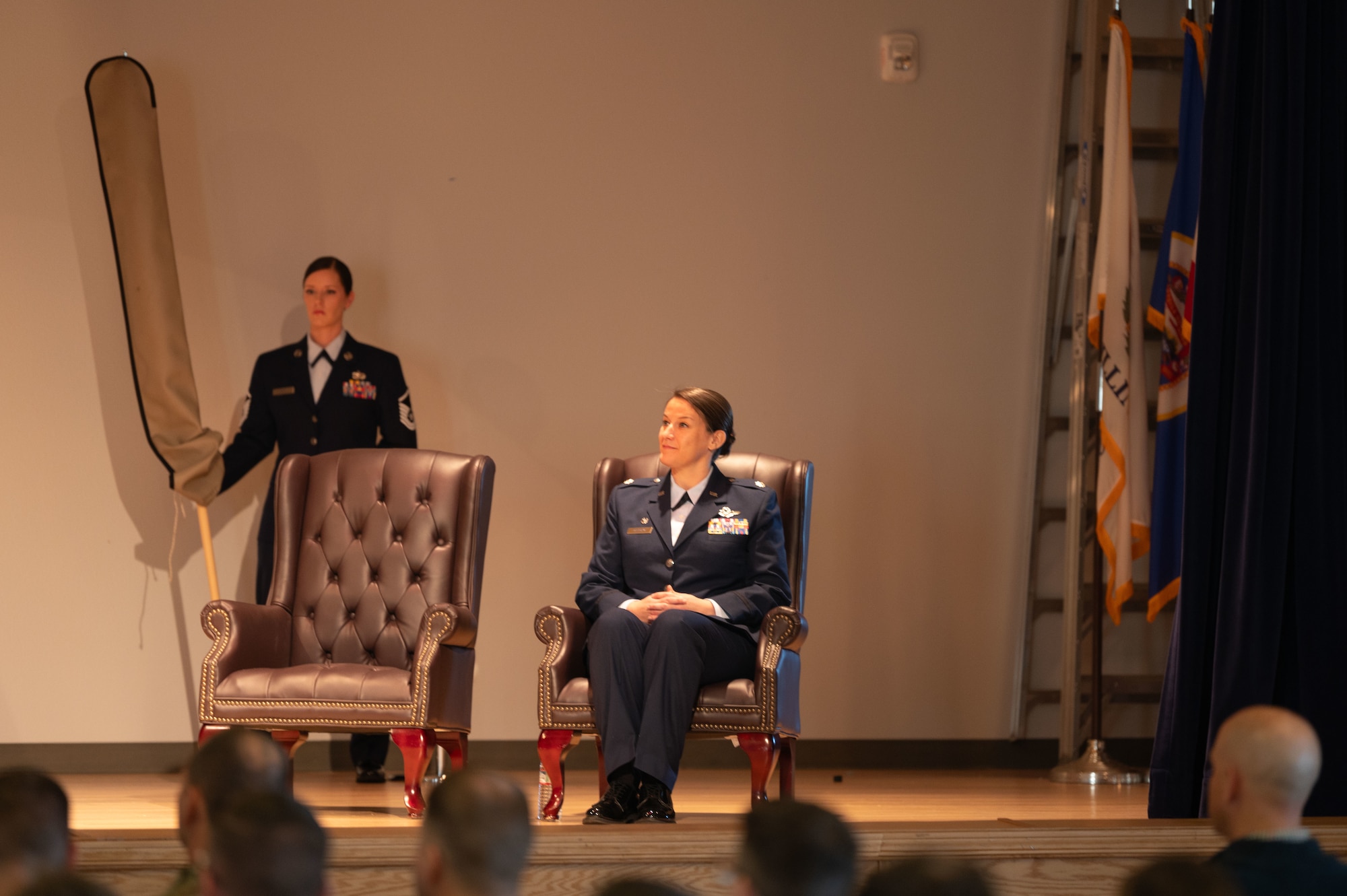U.S. Air Force Lt. Col. Nicole Ketron, 932nd Battle Management Control Squadron commander, listens to remarks made by Col. Michael Lynch, 461st Operations Group commander, during the activation and assumption of commander ceremony in the Community Activity Center at Beale Air Force Base, California, Jan 23, 2025.