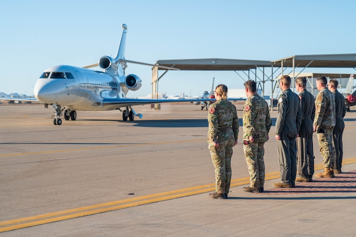 U.S. Air Force Col. Matthew Johnston (far right), 56th Fighter Wing deputy commander, and Chief Master Sgt. Jason Shaffer (second to right), 56th FW command chief, stand alongside members of the 312th Fighter Squadron as Maj. Gen. Theirry Dupont, Belgian Air and Space Component commander, arrives at Luke Air Force Base, Arizona, Jan. 13, 2025.