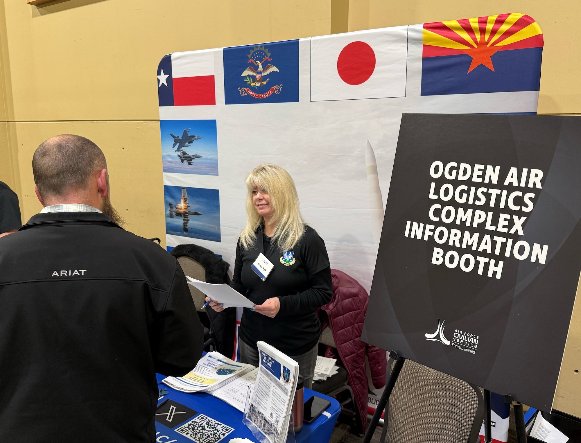 Recruiters from Hill Air Force Base meet with job seekers at a hiring event Jan. 16 at the Davis Conference Center. Job seekers were able to meet with representatives from several base organizations and multiple candidates received job offers. (U.S. Air Force photo by Kendahl Johnson)