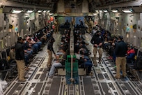 Illegal aliens await takeoff for a removal flight.