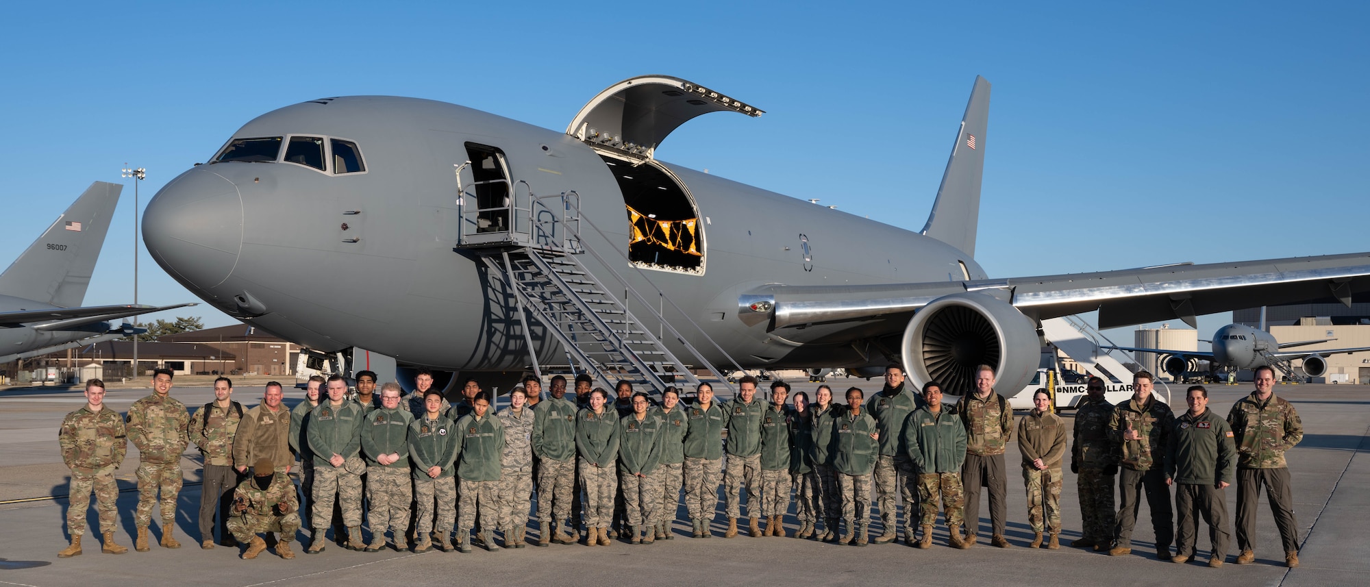 Students from Mount Olive High School Junior Reserve Officers' Training Corps and members of the 305th Air Mobility Wing pose for a photo in front of a KC-46A Pegasus while at Joint Base McGuire-Dix-Lakehurst, N.J., Jan. 14, 2025. JROTC Students from Mount Olive High School flew on the 2nd Aerial Refueling Squadron’s KC-46A as part of the Aviation Inspiration Mentorship program to enhance their understanding of the Air Force’s aviation mission. (U.S. Air Force photo by Senior Airman Aidan Thompson)