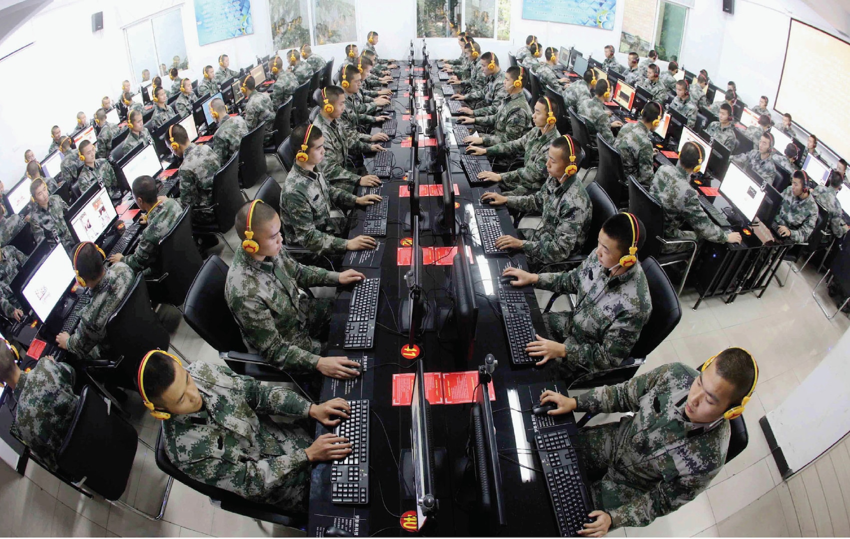 Chinese soldiers browse news on desktop computers at People’s Liberation Army garrison in Chongqing, China.