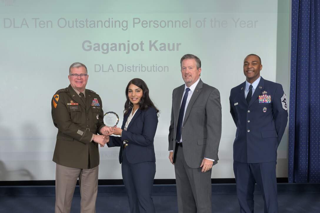 Pictured are DLA Director Army Lt. Gen. Mark Simerly, left; Gaganjot Kaur, general supply specialist at DLA Distribution and one of the agency’s top 10 employees; DLA Vice Director Brad Bunn; and DLA Senior Enlisted Leader Air Force Command Chief Master Sgt. Alvin Dyer.