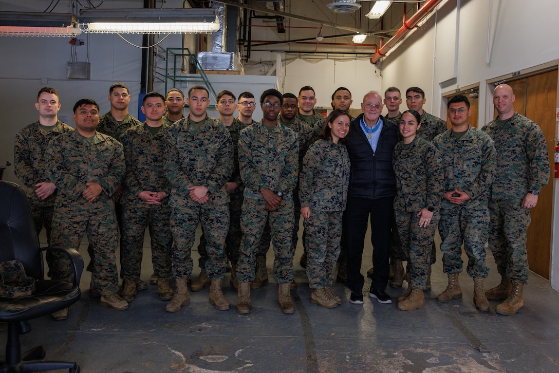 Robert M. Patterson, a retired U.S. Army Command Sergeant Major, Vietnam veteran, and a Medal of Honor recipient, poses for a group photo with Marines from Security Battalion during his visit to Marine Corps Base Quantico, Virginia, Jan. 23, 2025. On May 6, 1968, Patterson single-handedly destroyed five enemy bunkers by rifle and grenade fire, killing eight enemy soldiers, and captured seven weapons. His dauntless courage and heroism inspired his platoon to resume the attack and to penetrate the enemy defensive position. Patterson was awarded the distinguished Medal of Honor for his heroic actions during the Vietnam war. (U.S. Marine Corps photo by Lance Cpl. Braydon Rogers)