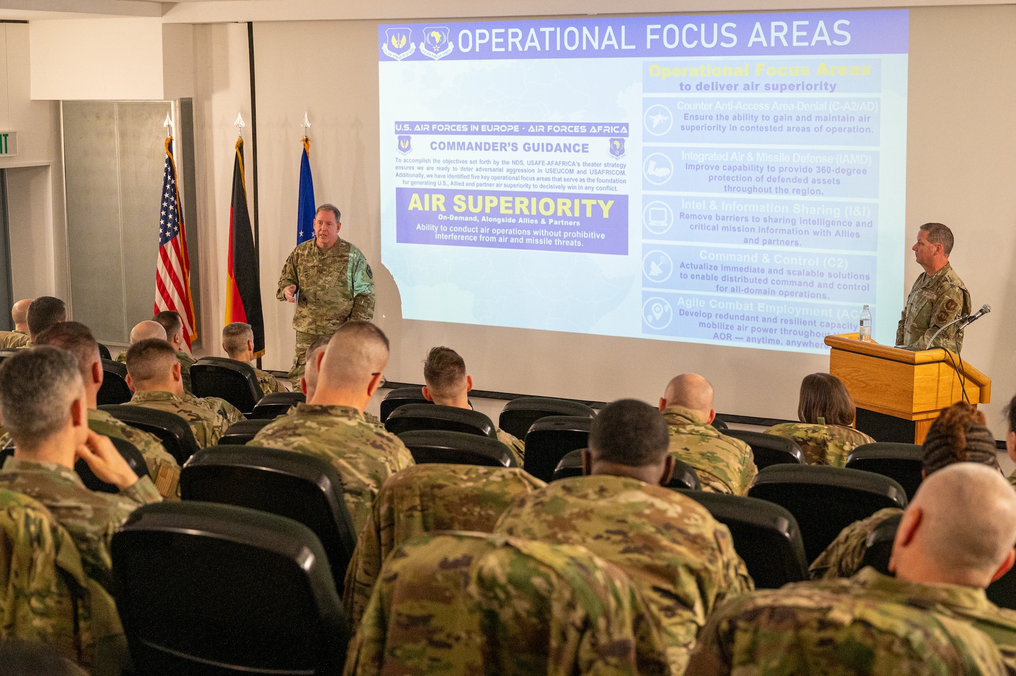 U.S. Air Force Gen. James B. Hecker, U.S. Air Forces in Europe and Air Forces Africa commander, and U.S. Air Force Chief Master Sgt. Randy Kwiatkowski, USAFE-AFAFRICA command chief, deliver an opening address for the 2025 USAFE-AFAFRICA Mission Support and Maintenance Group Strategy Conference at Ramstein Air Base, Germany, Jan. 22, 2025. The aim of the symposium was to enhance the strategic capabilities of squadron leaders across the USAFE-AFAFRICA area of responsibility, equipping them with essential tools and strategies to better serve their units. (U.S. Air Force photo by Senior Airman Renan Arredondo)