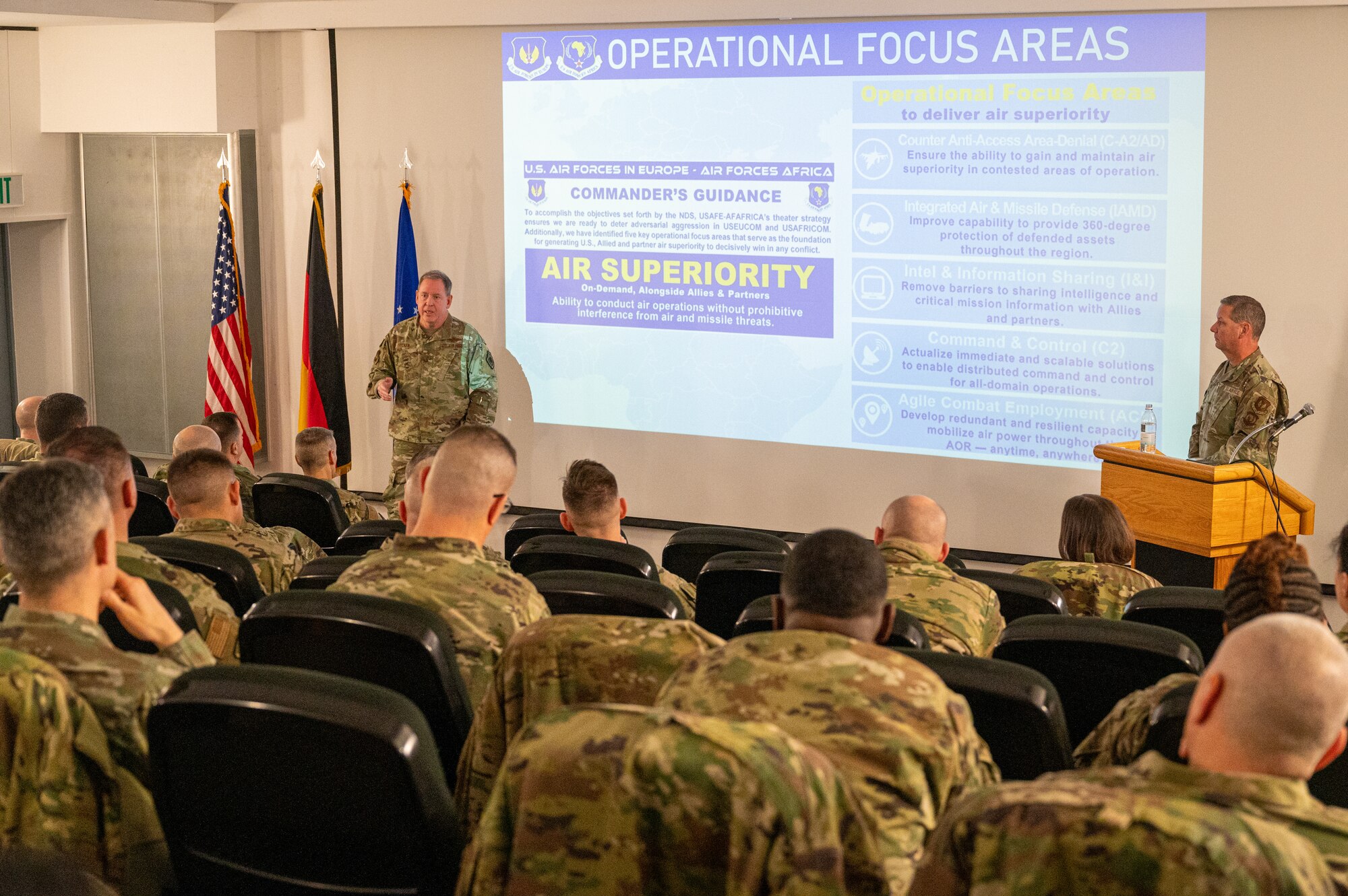 U.S. Air Force Gen. James B. Hecker, U.S. Air Forces in Europe and Air Forces Africa commander, and U.S. Air Force Chief Master Sgt. Randy Kwiatkowski, USAFE-AFAFRICA command chief, deliver an opening address for the 2025 USAFE-AFAFRICA Mission Support and Maintenance Group Strategy Conference at Ramstein Air Base, Germany, Jan. 22, 2025. The aim of the symposium was to enhance the strategic capabilities of squadron leaders across the USAFE-AFAFRICA area of responsibility, equipping them with essential tools and strategies to better serve their units. (U.S. Air Force photo by Senior Airman Renan Arredondo)
