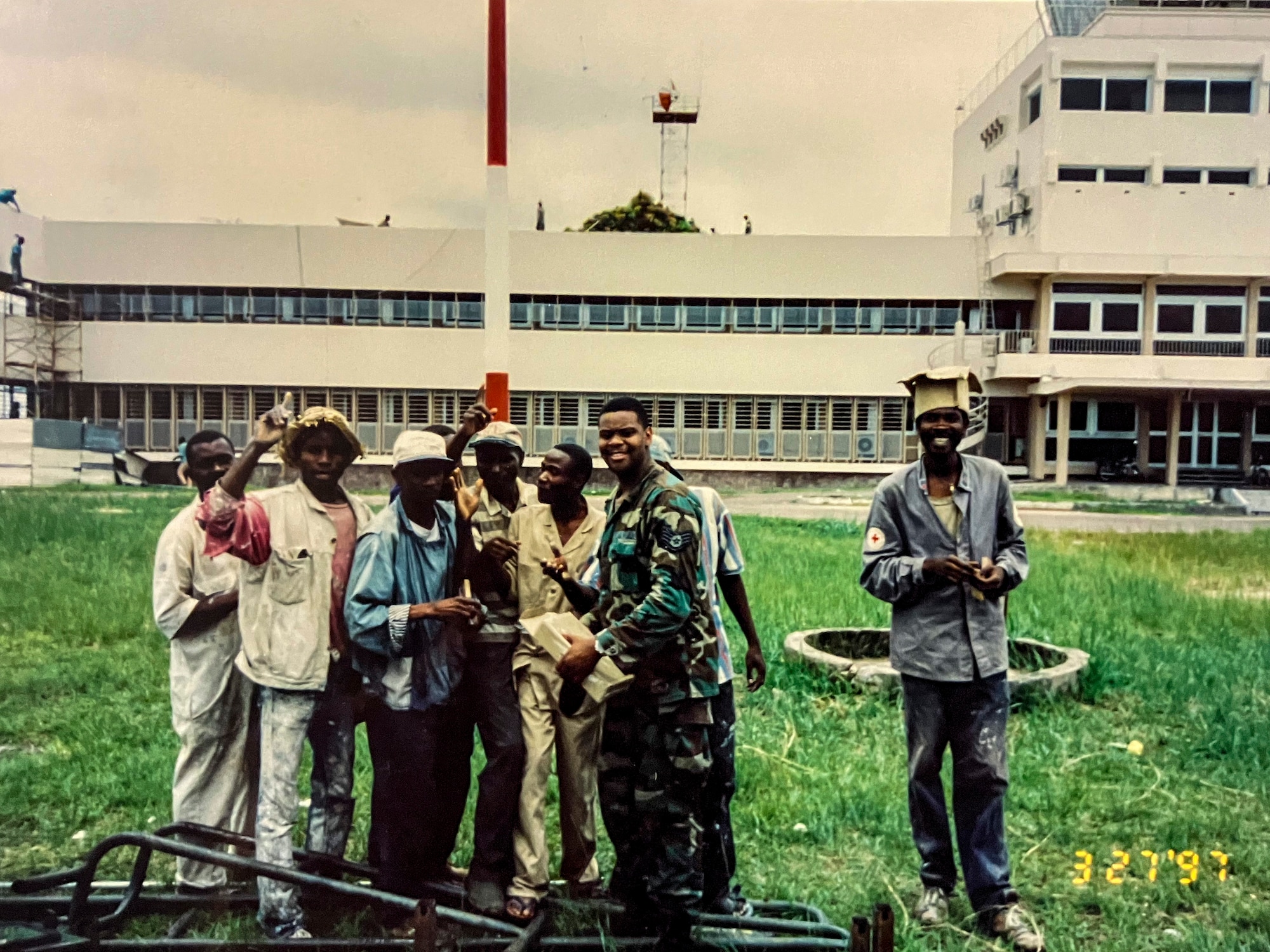Men pose for a photo.