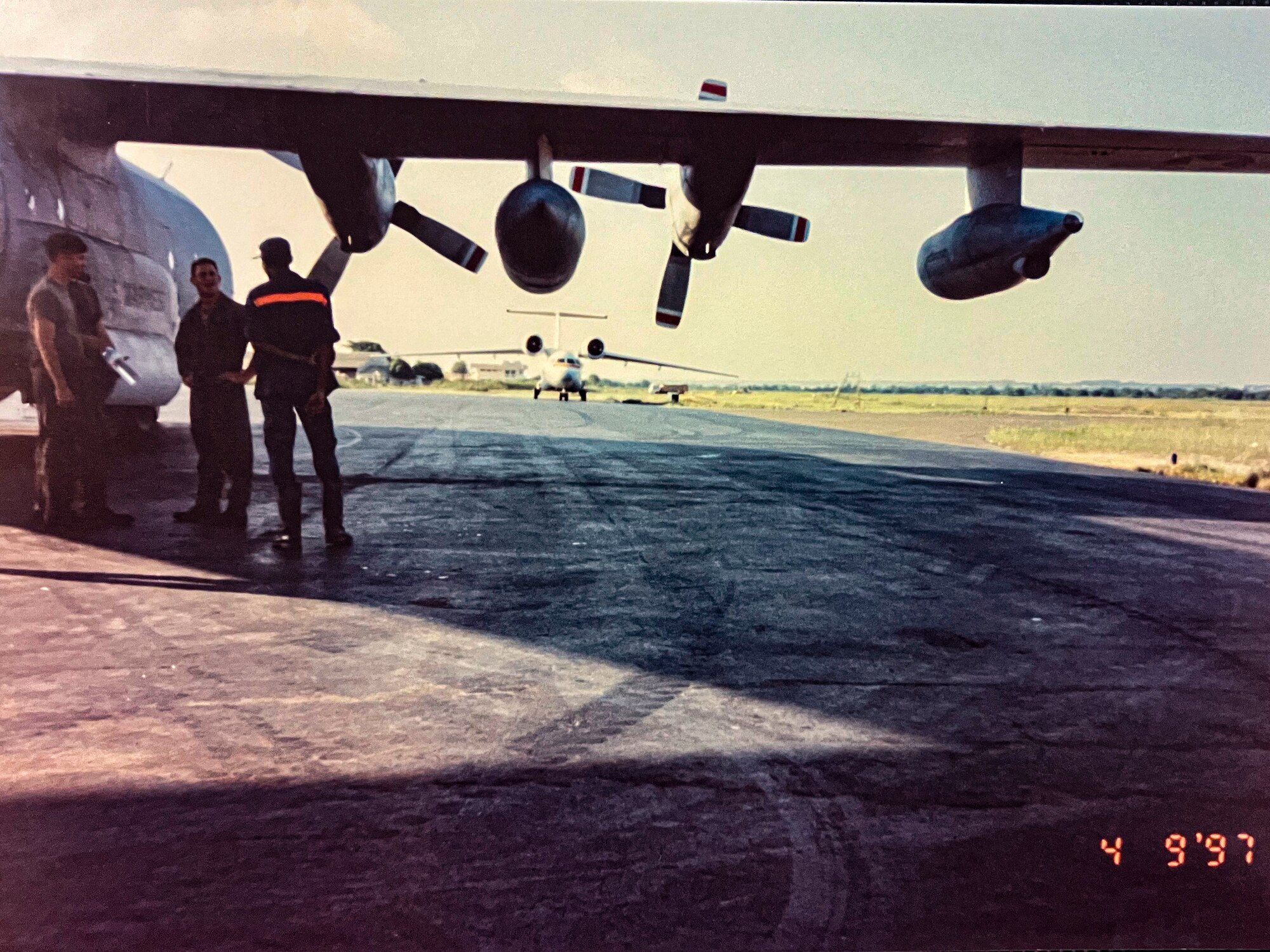 Men stand by plane.