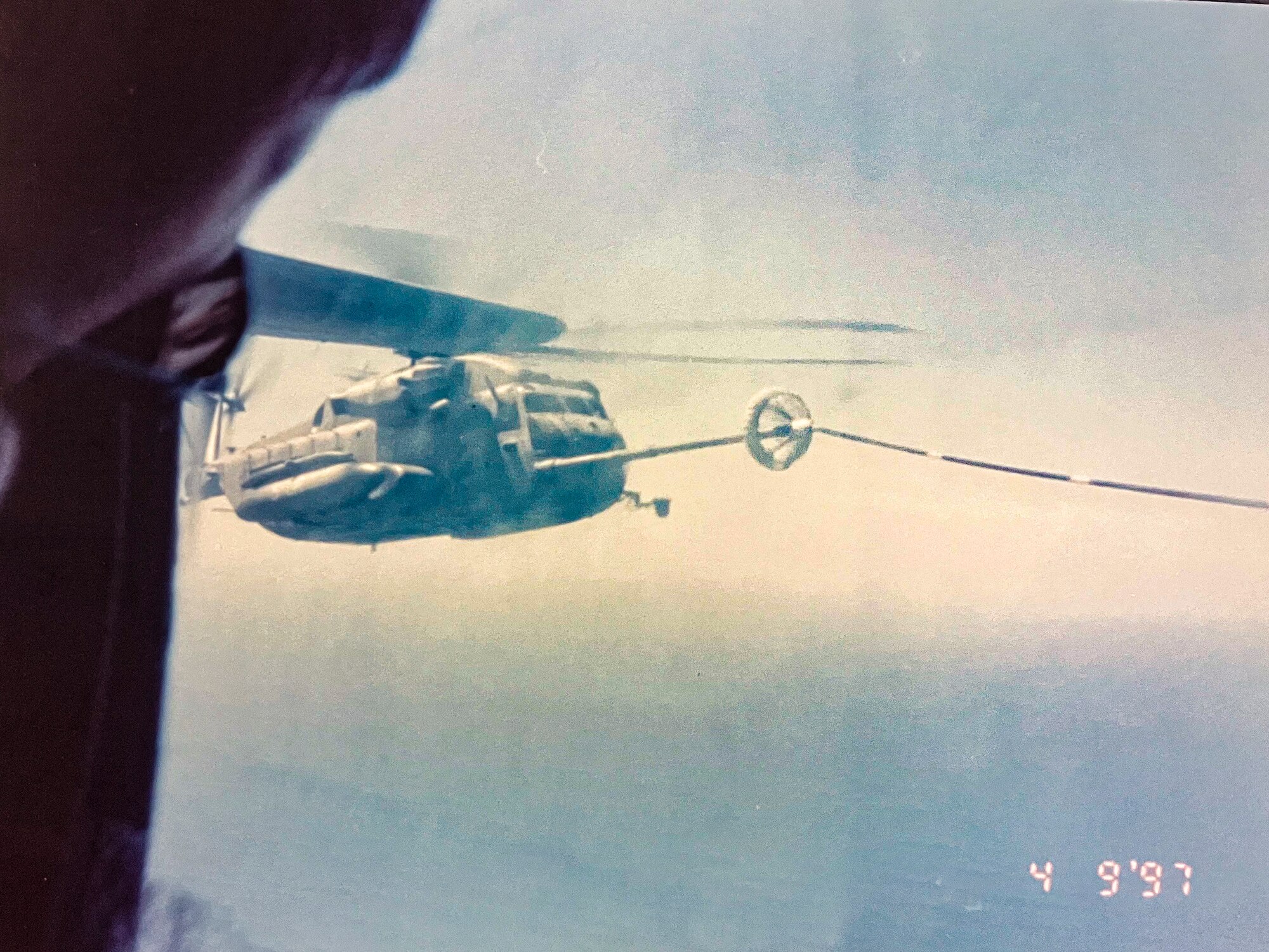 Helicopter is refueled in air.