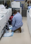 An U.S. Air Force laboratory technician performs maintenance on an automated analyzer at Wilford Hall Ambulatory Surgical Center, Jan. 27, 2025.