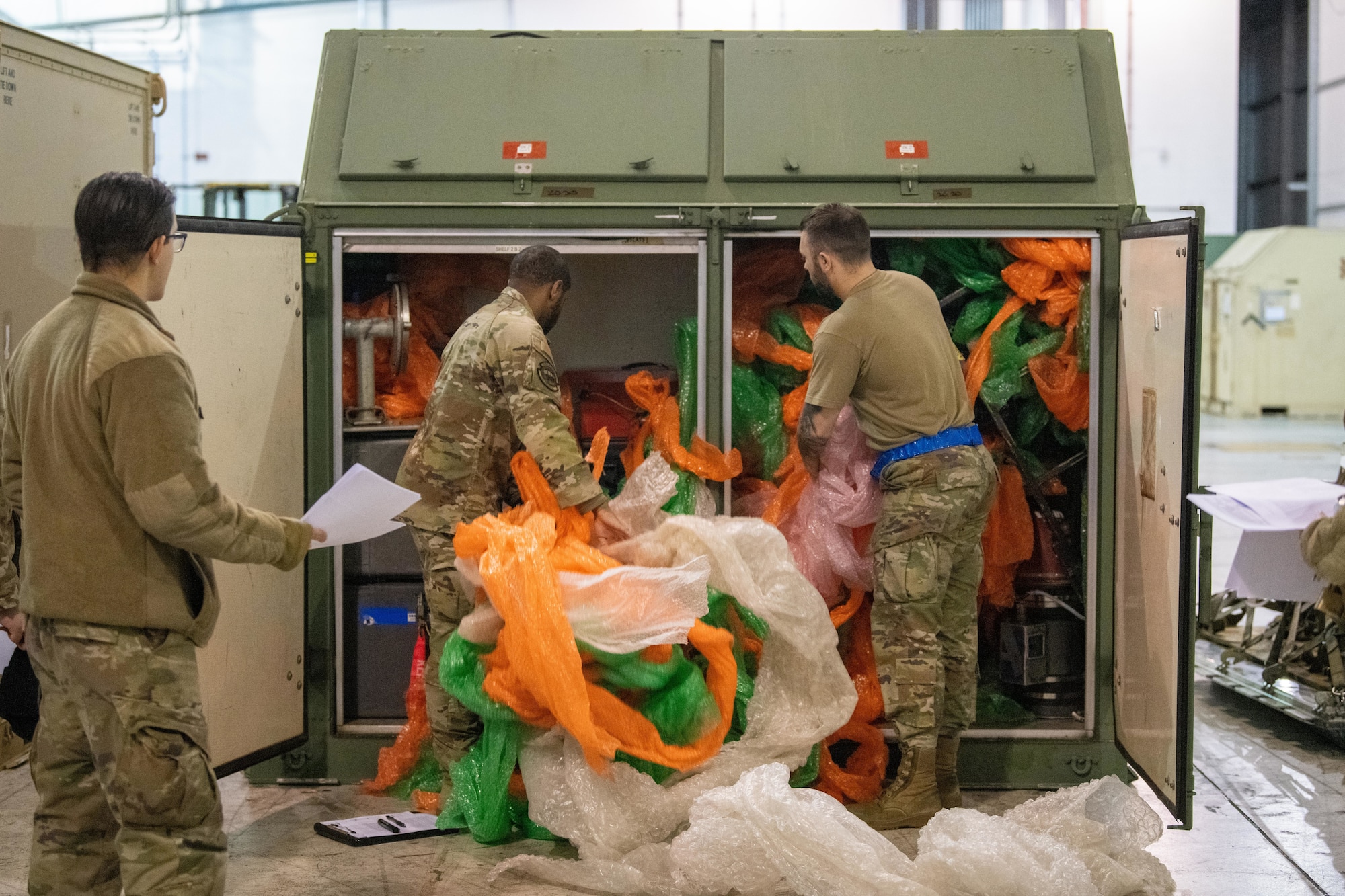 Airmen conduct a joint cargo inspection