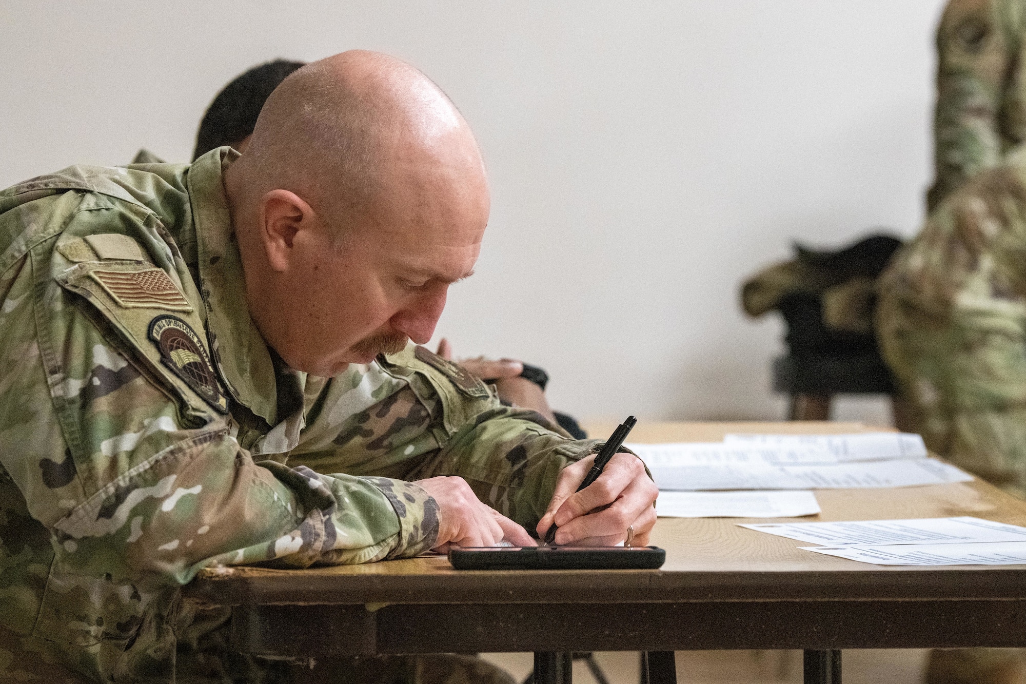 Airman conducts a passenger manifest
