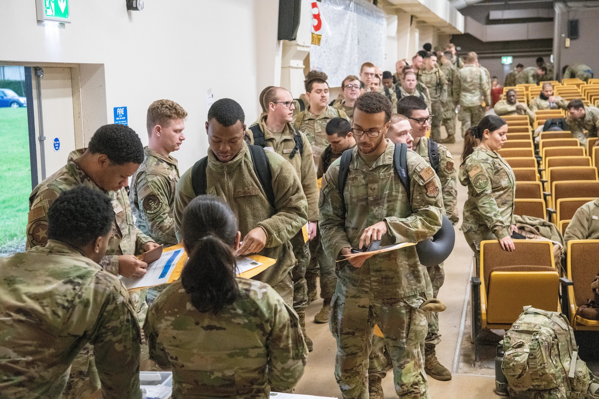 Airman wait in an outprocessing line