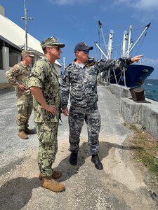 MAJURO, Republic of the Marshall Islands (Jan. 23, 2025) Republic of the Marshall Islands maritime security advisor Royal Australian Navy Lt. Cmdr. Lachlan Sommerville briefs Commander, Joint Task Force-Micronesia (JTF-M) Rear Adm. Greg Huffman on maritime operations at the port in Majuro, Jan. 23, 2025.