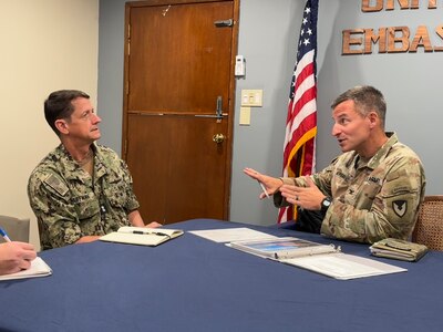 MAJURO, Republic of the Marshall Islands (Jan. 23, 2025) U.S. Army Garrison-Kwajalein Commander Col. Andrew Morgan (right) briefs Commander, Joint Task Force-Micronesia (JTF-M) Rear Adm. Greg Huffman about USAG Kwajalein operations during a meeting at the U.S. Embassy in Majuro, Jan. 23, 2025.