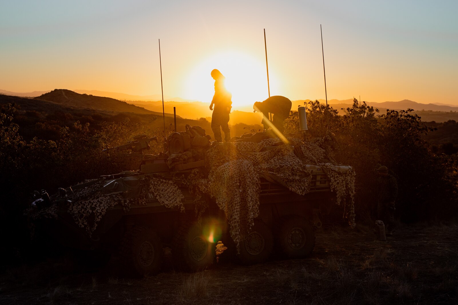 U.S. Marines with Charlie Company, 3rd Light Armored Reconnaissance Battalion, 1st Marine Division, unload equipment from an LAV-25 Light Armored Vehicle during Steel Knight 24 at Marine Corps Base Camp Pendleton, California, Dec. 10, 2024. Steel Knight is an annual exercise that takes place in multiple locations across the Southwest that allows I Marine Expeditionary Force to train as a full Marine Air-Ground Task Force and better integrate with joint and naval forces. (U.S. Marine Corps photo by Cpl. Grant Schirmer)