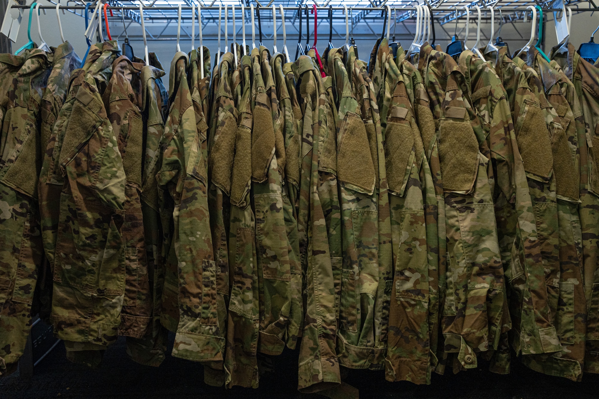 Uniform items hang at the Airman’s Attic, free to E-1 through E-6s at Cannon Air Force Base, New Mexico, Jan. 15, 2025. The Airman’s Attic is open Tuesday through Thursday from 8 a.m. to 4 p.m. and is available to all enlisted members from Airman Basic to Technical Sergeant, as well as their dependents. (U.S. Air Force photo by Airman 1st Class Tori Shearn)