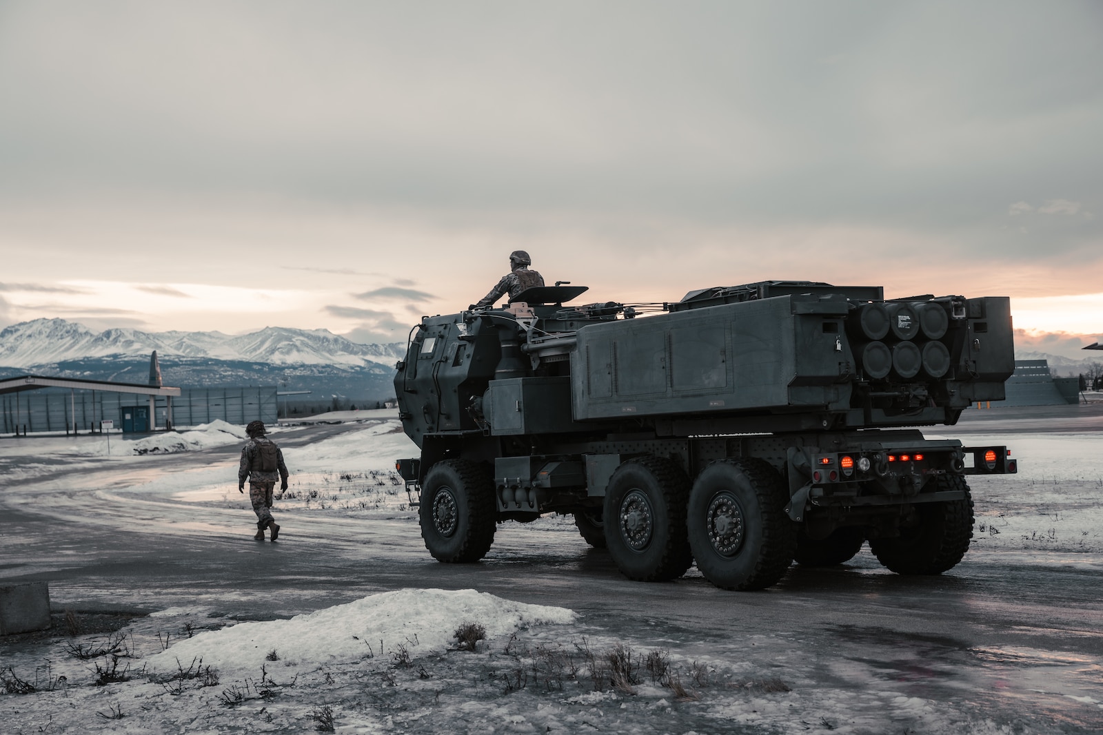 U.S. Marines with 1st Battalion, 11th Marine Regiment, 1st Marine Division, drive an M142 High Mobility Artillery Rocket System during HIMARS rapid infiltration training at Joint Base Elmendorf-Richardson, Alaska, Jan. 18, 2025.  HIRAIN training tests 1st Bn., 11th Marines’ ability to rapidly deploy HIMARS to provide accurate, long-range fire in key terrain. (U.S. Marine Corps photo by Cpl. Juan Torres)