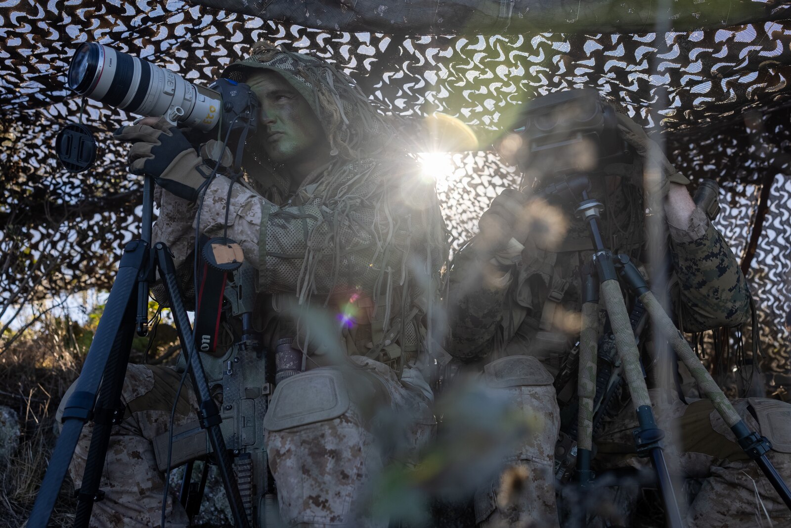 U.S. Marine Corps Sgt. Logan Mitchell, left, and Cpl. Cole Miller, both reconnaissance Marines with Alpha Company, 1st Reconnaissance Battalion, 1st Marine Division, conduct reconnaissance and surveillance as part of Steel Knight 24 at San Clemente Island, California, Dec. 9, 2024. Steel Knight is an annual exercise that takes place in multiple locations across the Southwest that allows I Marine Expeditionary Force to train as a full Marine Air-Ground Task Force and better integrate with joint and naval forces. Mitchell is a native of Arizona, and Miller is a native of Washington. (U.S. Marine Corps photo by Sgt. Kyle Chan)