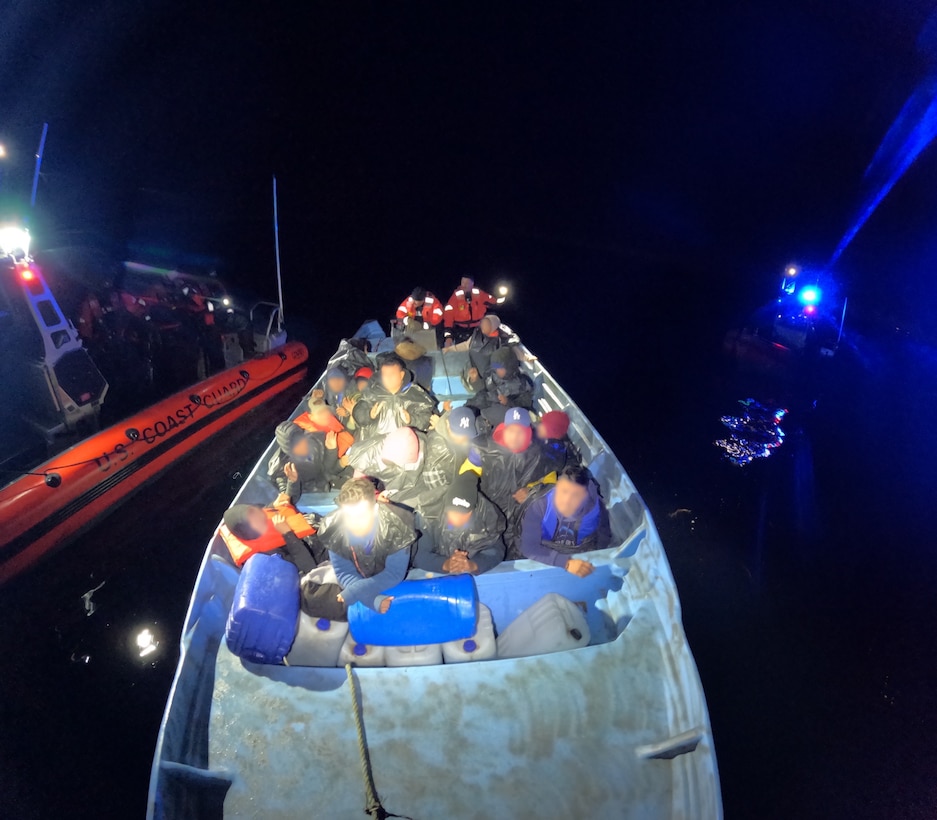 Coast Guard and partnership agencies process individuals ashore following the interdiction of a migrant vessel approximately 20 miles off the coast of Point Loma, California, Jan. 28, 2025