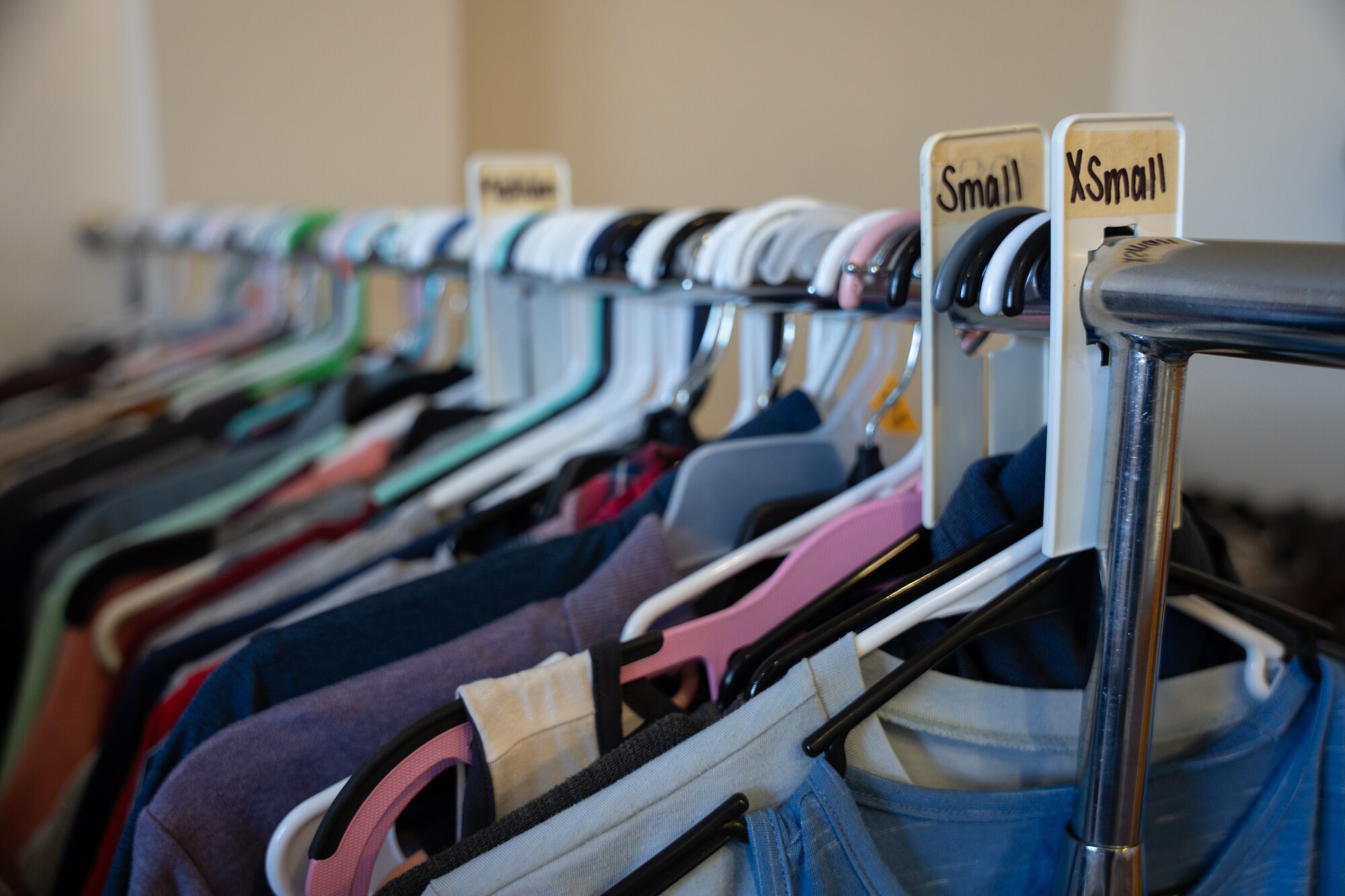 Donated goods hang at the Airman’s Attic after being organized by volunteers and members of the Airman Resiliency and Capability flight, at Cannon Air Force Base, New Mexico, Jan. 15, 2025. The Airman’s Attic is a facility dedicated for Airmen, noncommissioned officers and their dependents to choose from free donated clothing and food. (U.S. Air Force photo by Airman 1st Class Tori Shearn)
