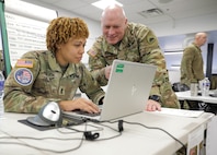 Sgt. Maj. Khalia Jackson, Operations Sergeant Major, 74th Troop Command  Transportation Company, works along side Col. R. Brian Deaton, Chief of Staff for the District of Columbia National Guard in Washington, D.C. during 60th Presidential Inauguration on Jan 19, 2025. Approximately 8,000 National Guard service members from approximately 40 states and territories comprise JTF-DC to support the 60th Presidential Inauguration, continuing a legacy that began in 1789 when their predecessors escorted George Washington to the first inauguration. At the request of civil authorities, these National Guard service members provide critical support such as crowd management, traffic control points, CBRN response, civil disturbance response and sustainment operations. Their expertise and seamless collaboration with interagency partners help ensure a safe and peaceful transition of power during this historic event.