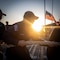 Sailors handle a mooring line on the flight deck of the Arleigh Burke-class guided-missile destroyer USS Sampson (DDG 102) while departing Naval Base San Diego, Jan. 23, 2025.