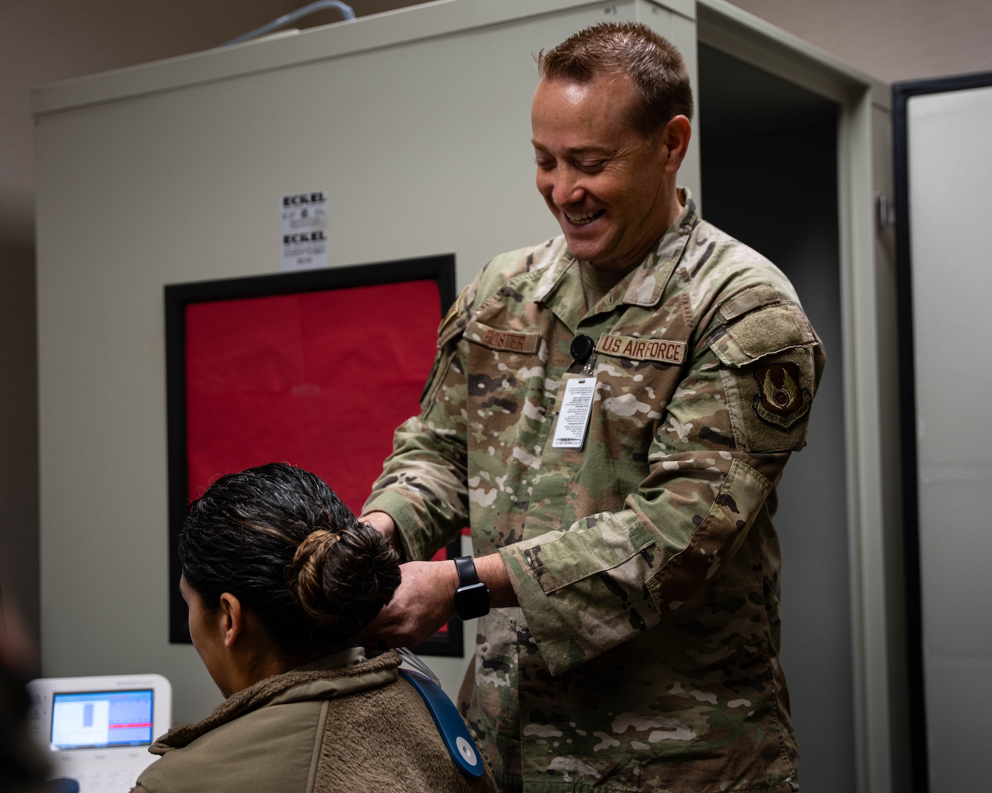Lt. Col. John Foster, United States Air Force Hearing Conservation Program Manager, demonstrates tele-audiology operations to Airmen from the 27th Special Operations Medical Group at Cannon Air Force Base, New Mexico, Dec. 10, 2024. The introduction of this technology shows the strength of the Air Force's partnership with the Defense Health Agency to improve efficiency, reduce costs, and enhance personnel health and readiness. (U.S. Air Force photo by Senior Airman Mateo Parra)