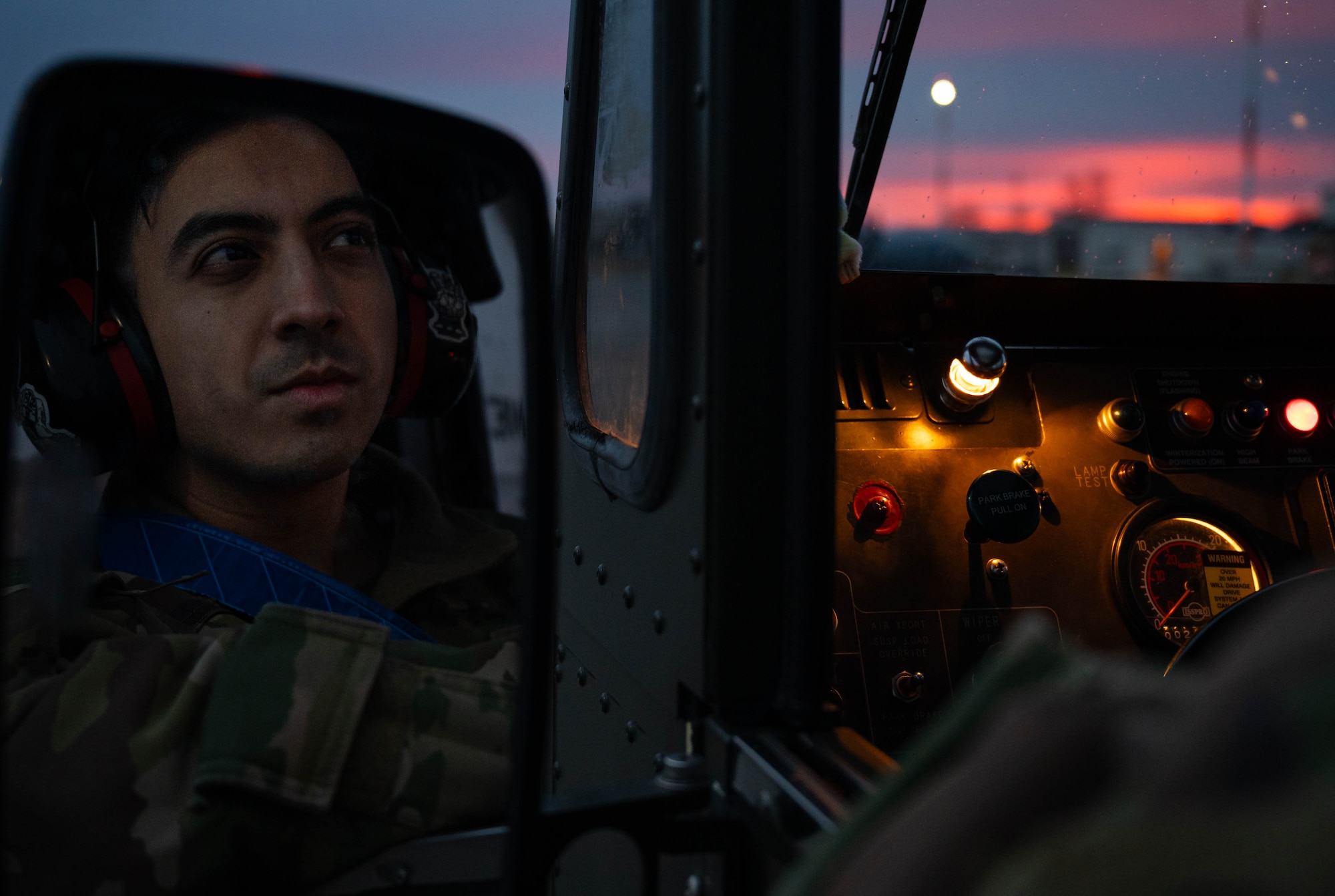 U.S. Air Force Senior Airman Mayde Romero, 721st Aerial Port Squadron driver, prepares to transport a C-130J Super Hercules aircraft wing on a k-loader at Ramstein Air Base, Germany, Jan. 25, 2025. This was the first airlift operation of this specific wing which required a custom fixture to make it possible to be transported via aircraft. (U.S. Air Force photo by Senior Airman Jared Lovett)