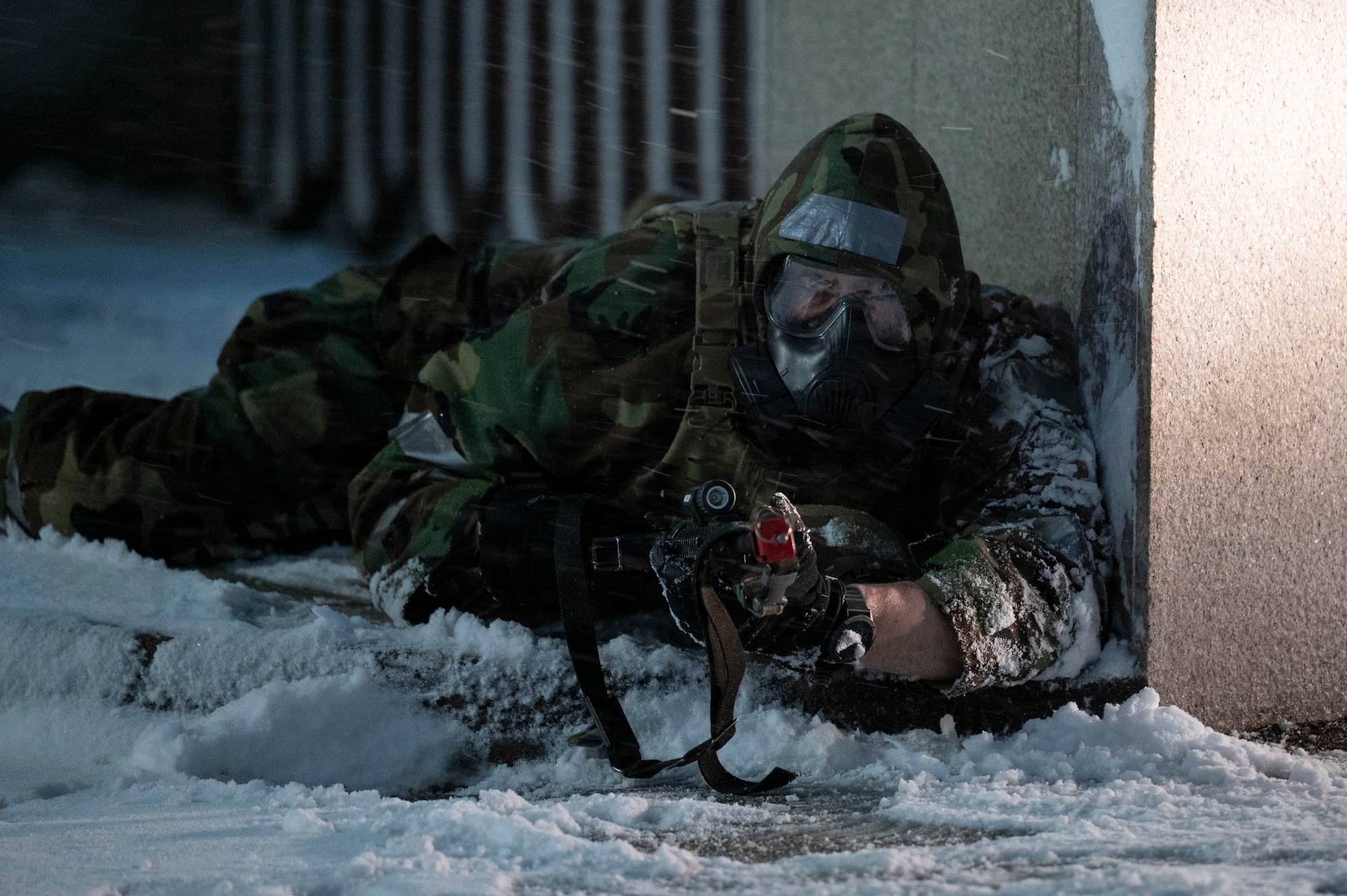 U.S. Air Force Master Sgt. Geoffrey Nesbit, 51st Security Forces Squadron flight chief, takes cover from a simulated ground attack during Beverly Herd 25-2 at Osan Air Base, Republic of Korea, Jan. 27, 2025.