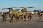 Texas National Guard troops load into CH-47 Chinook helicopters at Naval Air Station Joint Reserve Base Fort Worth.