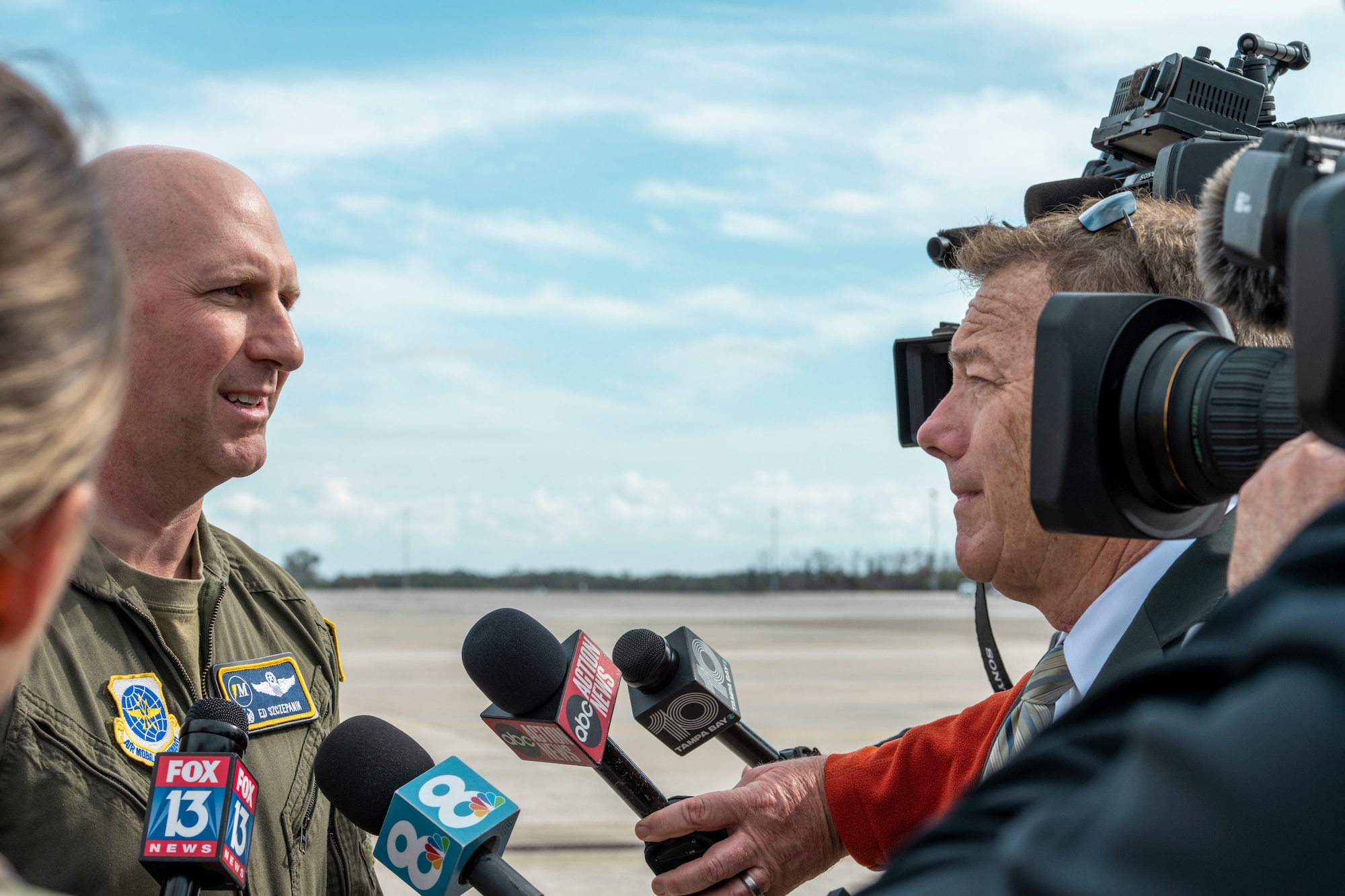 U.S. Air Force Col. Edward Szczepanik, 6th Air Refueling Wing commander, answers media questions following the KC-46 Pegasus groundbreaking ceremony at MacDill Air Force Base, Florida, Jan. 28, 2025. The ceremony marked the start of MacDill’s journey to adapt its hangars, flightline and runways to welcome the KC-46 and phase out the KC-135 Stratotanker. (U.S. Air Force photo by Airman Monique Stober)