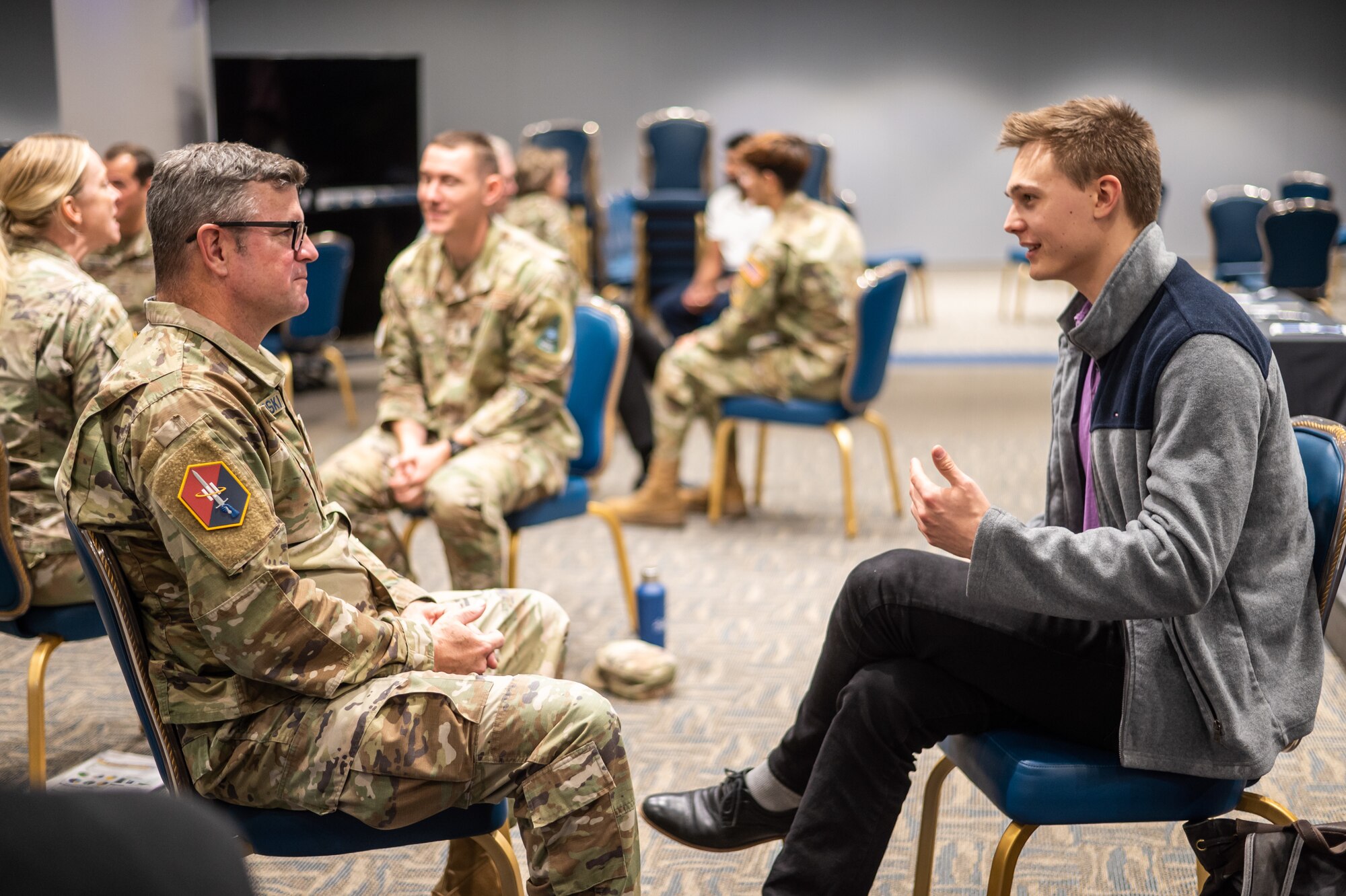 Col Andrew Dermanoski, commander, Space Base Delta 3, left, listens as a mentee describes his career goals at the SSC speed mentoring event Jan. 16, 2025 at SSC. Photo by Van de Ha, USSF.