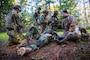 U.S. Navy Hospital Corpsman 3rd Class Joshua Anchanzar, right, with 2nd Medical Battalion, 2nd Marine Logistics Group, and Dutch service members perform tactical casualty combat care during Burmese Chase 24 at Marine Corps Base Camp Lejeune, North Carolina, Sept. 17, 2024. Burmese Chase is an annual U.S. led, multi-lateral exercise that includes training on integration of ground and air fires, infantry tactics and naval gunfire alongside NATO allies. (U.S. Marine Corps photo by Cpl. Jacquilyn Davis)