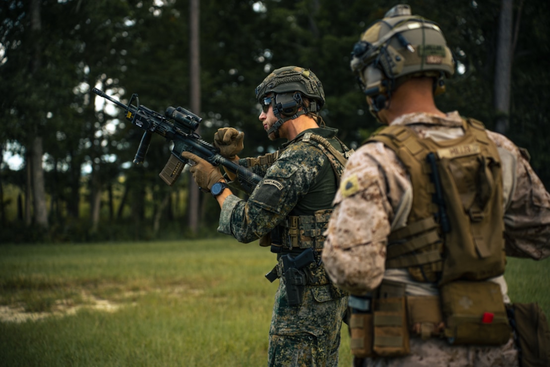 A Dutch service member conducts a function check on a Colt Canadian C7A3 carbine rifle at a small arms live-fire range during Burmese Chase 24, at Marine Corps Base Camp Lejeune, North Carolina, Sept. 19, 2024. Burmese Chase is an annual U.S. led, multi-lateral exercise that includes training on integration of ground and air fires, infantry tactics and naval gunfire alongside NATO allies. (U.S. Marine Corps photo by Cpl. Maurion Moore)