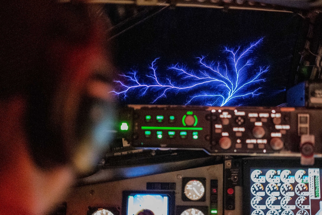 Air Force Capt. Russell Ellis flies a routine tanker mission over the U.S. Central Command area of responsibility as St. Elmo's Fire, a weather phenomenon observable in atmospheric electric fields, flashes across the window, Jan. 22, 2025.